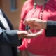 Someone handing keys to someone else